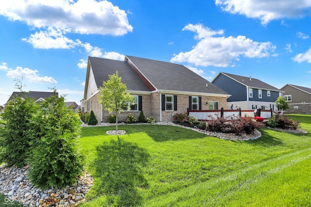 1684 Beach St, Greenwood, IN 46143 - rear view of house with brick siding, a deck, and a yard