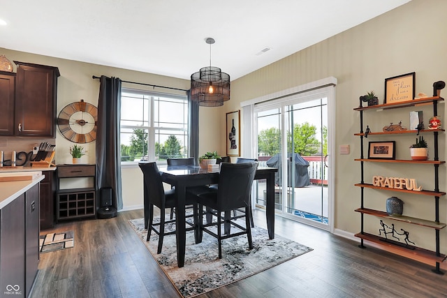 1684 Beach St, Greenwood, IN 46143 - dining space featuring baseboards, visible vents, a healthy amount of sunlight, and dark wood finished floors