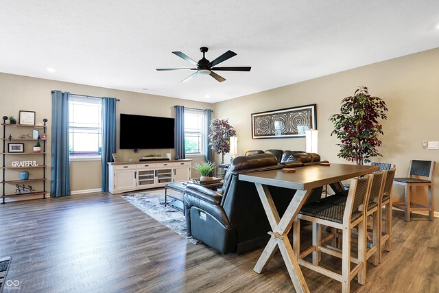 1684 Beach St, Greenwood, IN 46143 - living room featuring baseboards, wood finished floors, and a ceiling fan