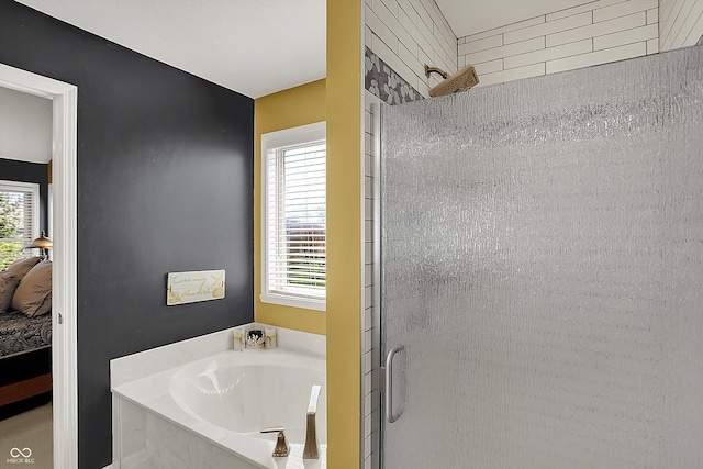 bathroom featuring a shower stall, a garden tub, and connected bathroom
