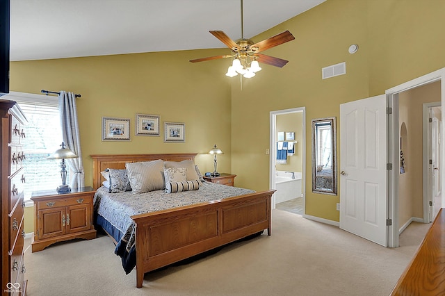 bedroom with light carpet, ensuite bathroom, baseboards, and visible vents