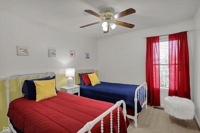 carpeted bedroom with visible vents and ceiling fan