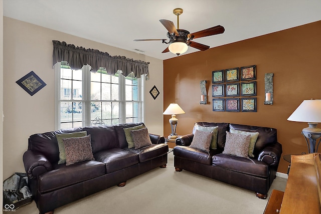 carpeted living room with a ceiling fan and visible vents