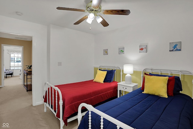 bedroom featuring carpet flooring, baseboards, and ceiling fan