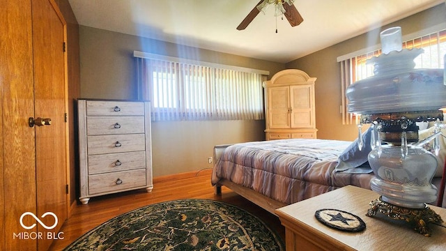 bedroom featuring wood finished floors and a ceiling fan