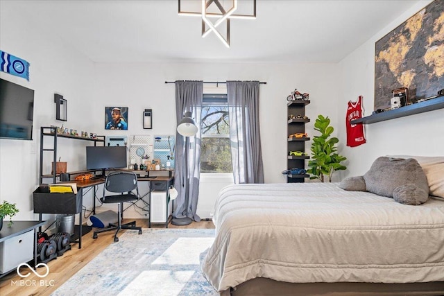 bedroom with wood finished floors