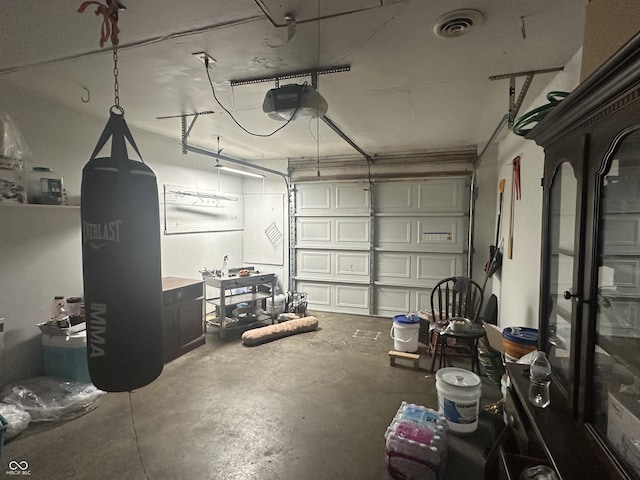 garage with visible vents and a garage door opener