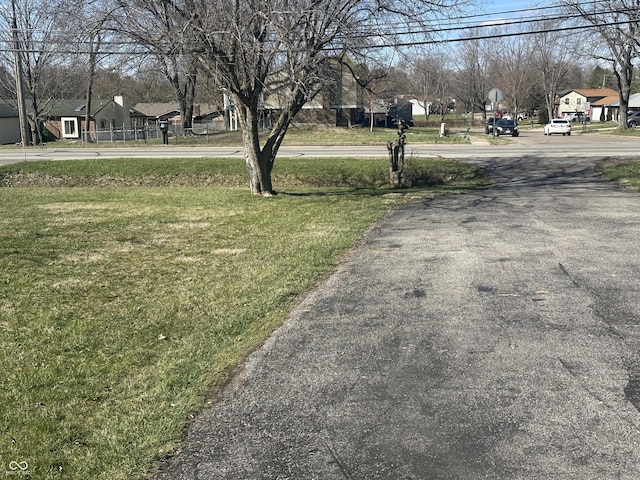 view of street featuring a residential view and traffic signs