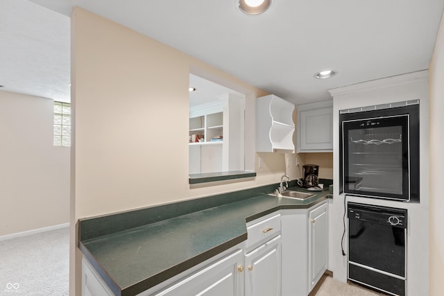 7341 Campfire Run, Indianapolis, IN 46236 - kitchen with dark countertops, a sink, light colored carpet, wine cooler, and dishwasher