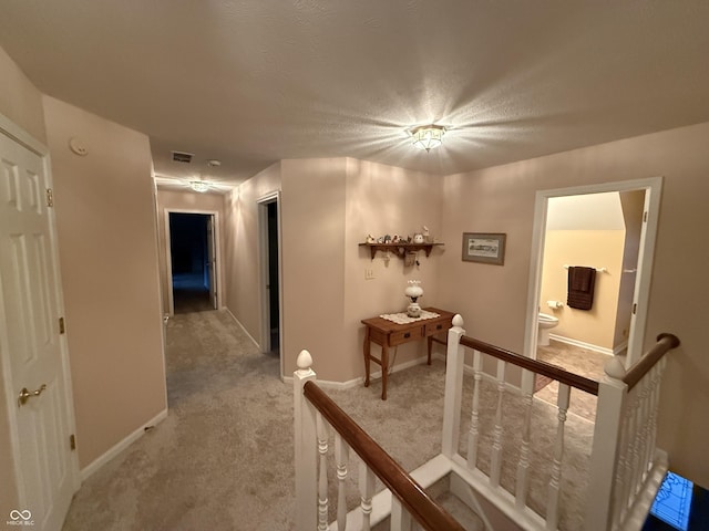 7341 Campfire Run, Indianapolis, IN 46236 - corridor featuring an upstairs landing, carpet, and baseboards