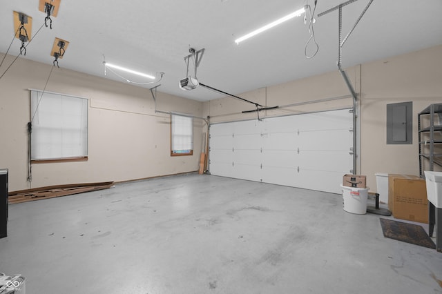 garage featuring electric panel and a garage door opener
