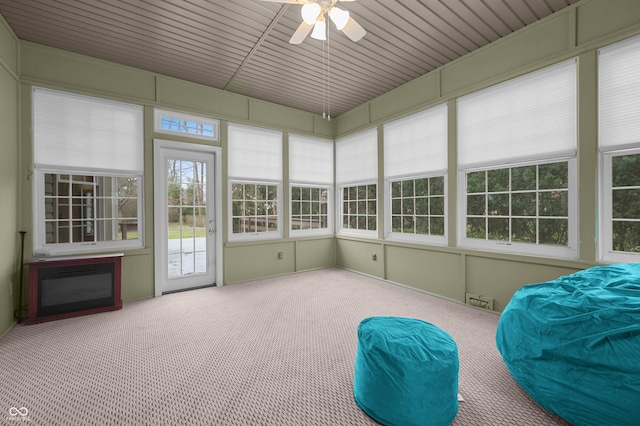 unfurnished sunroom featuring carpet floors