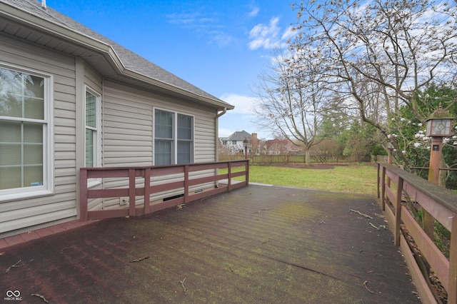 wooden terrace with a lawn