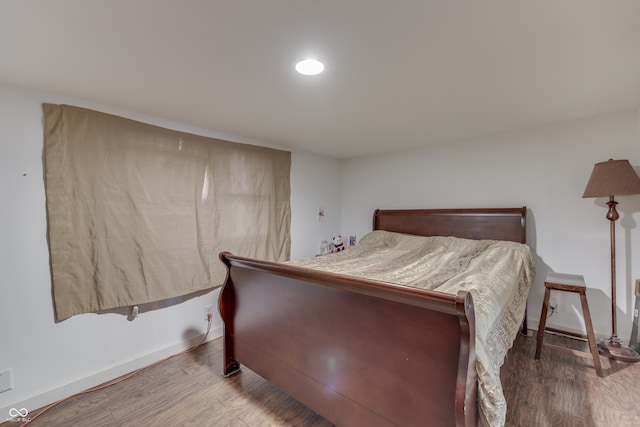 5110 Chelsea Rd, Indianapolis, IN 46241 - bedroom with baseboards and wood finished floors