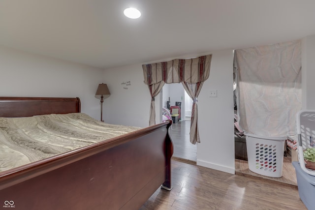 5110 Chelsea Rd, Indianapolis, IN 46241 - bedroom featuring baseboards and wood finished floors