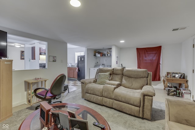 5110 Chelsea Rd, Indianapolis, IN 46241 - living room featuring recessed lighting, independent washer and dryer, baseboards, light tile patterned flooring, and visible vents