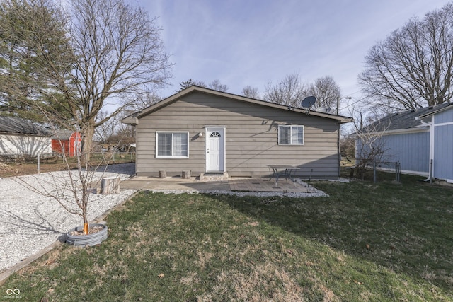 5110 Chelsea Rd, Indianapolis, IN 46241 - rear view of house featuring a patio, fence, and a lawn