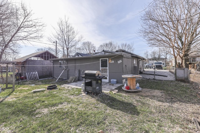 5110 Chelsea Rd, Indianapolis, IN 46241 - back of property featuring a patio, a gate, fence, and a yard