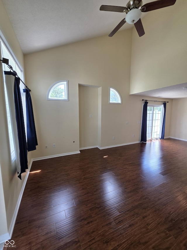 8160 Shores Edge Way, Indianapolis, IN 46237 - unfurnished living room with ceiling fan, high vaulted ceiling, wood finished floors, and baseboards
