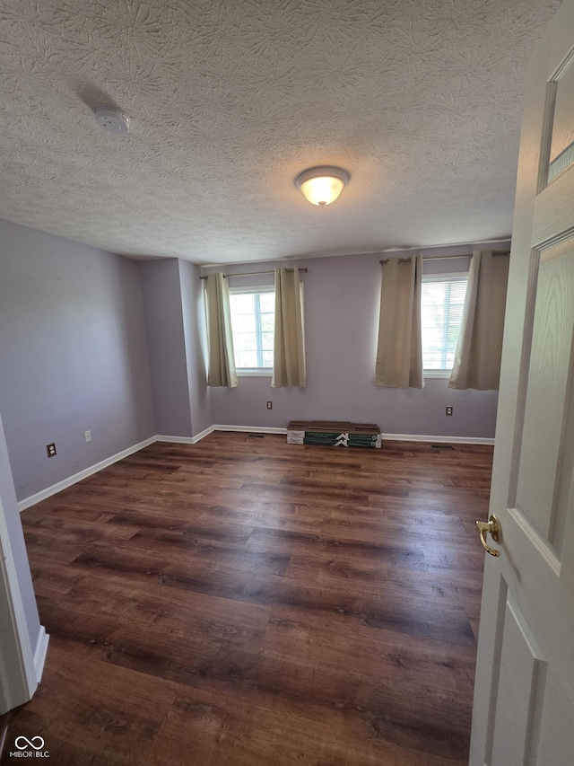 8160 Shores Edge Way, Indianapolis, IN 46237 - spare room with wood finished floors, baseboards, and a textured ceiling