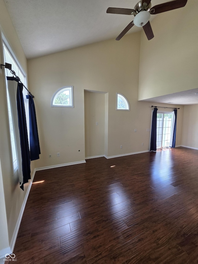 8160 Shores Edge Way, Indianapolis, IN 46237 - unfurnished living room with ceiling fan, high vaulted ceiling, wood finished floors, and baseboards