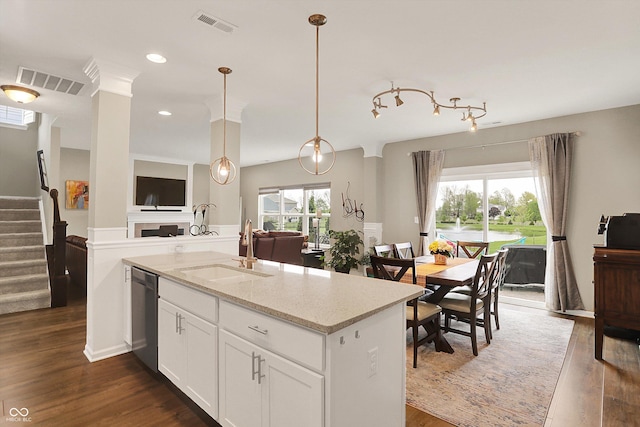 15752 Matthews Ln, Noblesville, IN 46060 - kitchen featuring visible vents, dishwasher, a sink, light stone counters, and open floor plan