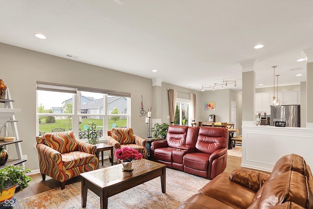 15752 Matthews Ln, Noblesville, IN 46060 - living room featuring light wood-style floors, recessed lighting, and visible vents