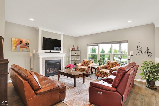 15752 Matthews Ln, Noblesville, IN 46060 - living room featuring recessed lighting, baseboards, wood finished floors, and a fireplace