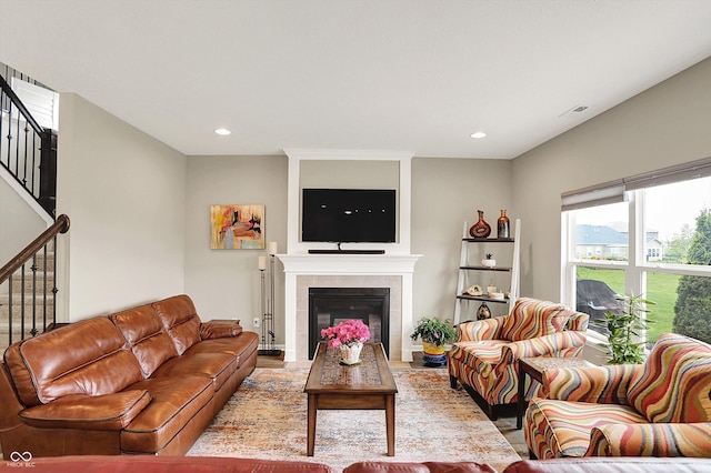 15752 Matthews Ln, Noblesville, IN 46060 - living area with a fireplace, stairs, recessed lighting, wood finished floors, and visible vents