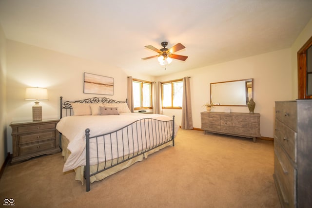 7732 Ashtree Dr, Indianapolis, IN 46259 - bedroom with light carpet, baseboards, and a ceiling fan
