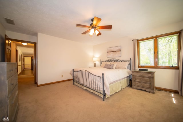 7732 Ashtree Dr, Indianapolis, IN 46259 - bedroom with baseboards, visible vents, and light colored carpet