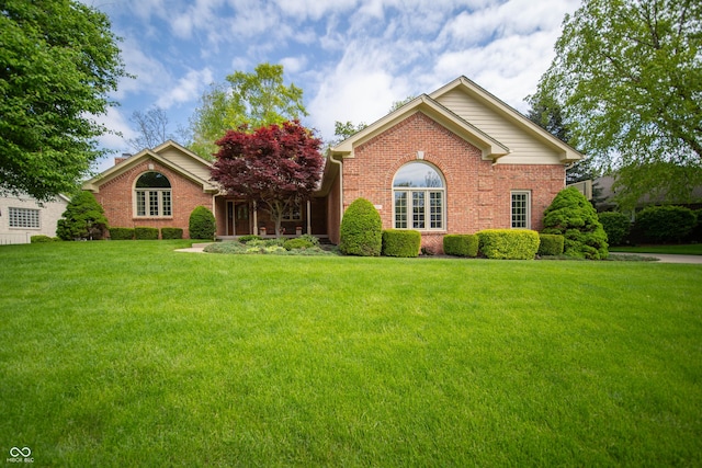 7732 Ashtree Dr, Indianapolis, IN 46259 - ranch-style house with a front yard and brick siding