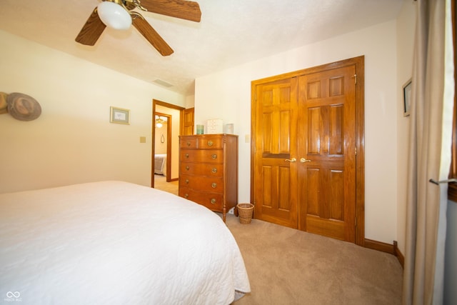 7732 Ashtree Dr, Indianapolis, IN 46259 - bedroom with light colored carpet, a closet, ceiling fan, and visible vents