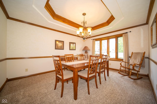 7732 Ashtree Dr, Indianapolis, IN 46259 - dining space featuring light colored carpet, crown molding, a chandelier, a tray ceiling, and baseboards