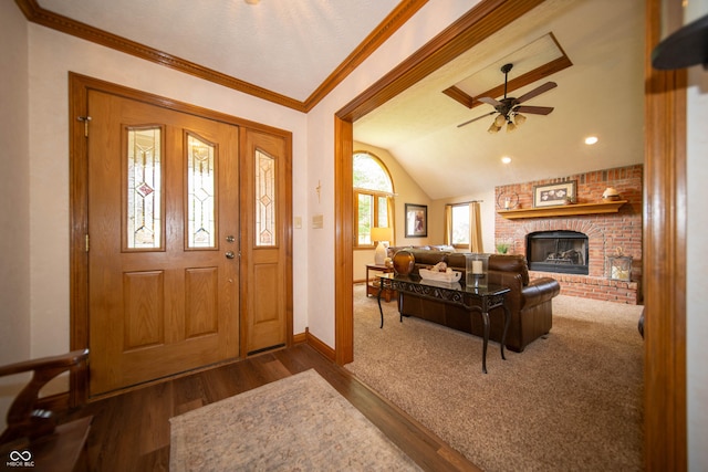 7732 Ashtree Dr, Indianapolis, IN 46259 - foyer featuring wood finished floors, a ceiling fan, a fireplace, baseboards, and lofted ceiling