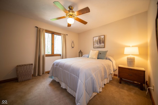 7732 Ashtree Dr, Indianapolis, IN 46259 - bedroom featuring carpet, baseboards, and a ceiling fan