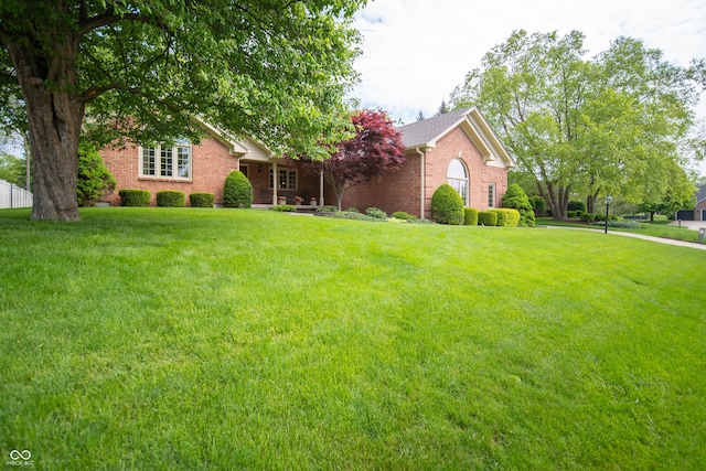 7732 Ashtree Dr, Indianapolis, IN 46259 - view of front facade with brick siding and a front yard