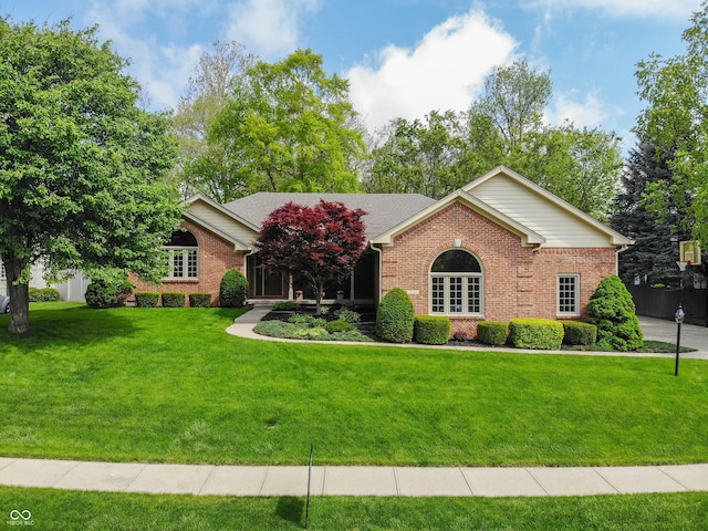 7732 Ashtree Dr, Indianapolis, IN 46259 - ranch-style house featuring brick siding and a front yard