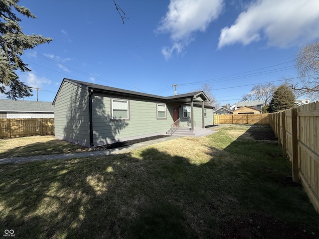 240 E Caven St E, Indianapolis, IN 46225 - back of property with a fenced backyard and a lawn