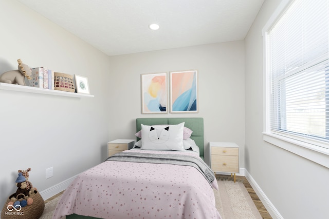 240 E Caven St E, Indianapolis, IN 46225 - bedroom featuring baseboards and wood finished floors
