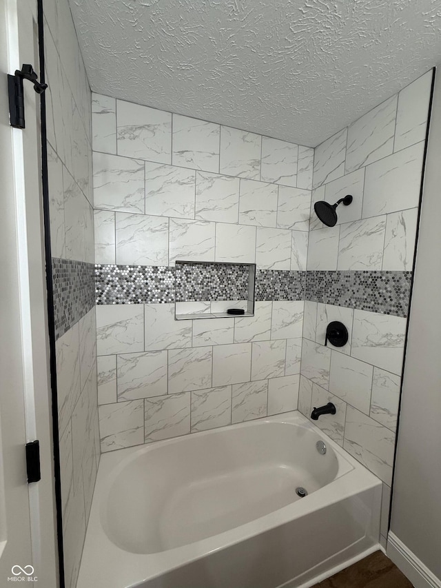 240 E Caven St E, Indianapolis, IN 46225 - bathroom with bathtub / shower combination and a textured ceiling