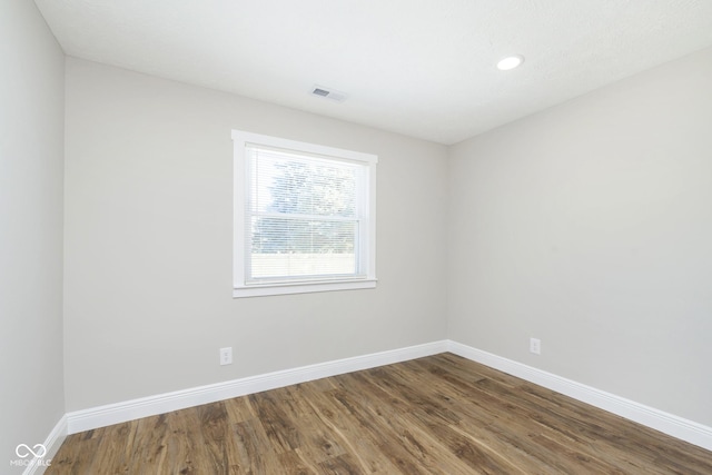 240 E Caven St E, Indianapolis, IN 46225 - empty room featuring baseboards, visible vents, wood finished floors, and recessed lighting