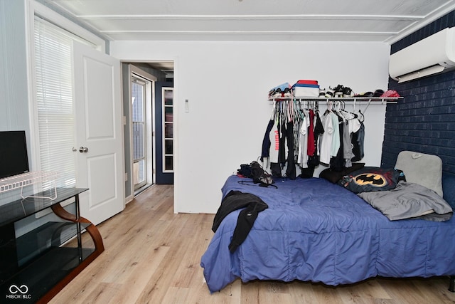 3041 S Kercheval St, Indianapolis, IN 46239 - bedroom with a wall mounted AC and wood finished floors