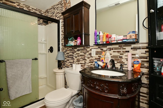3041 S Kercheval St, Indianapolis, IN 46239 - bathroom with toilet, vanity, a stall shower, and visible vents