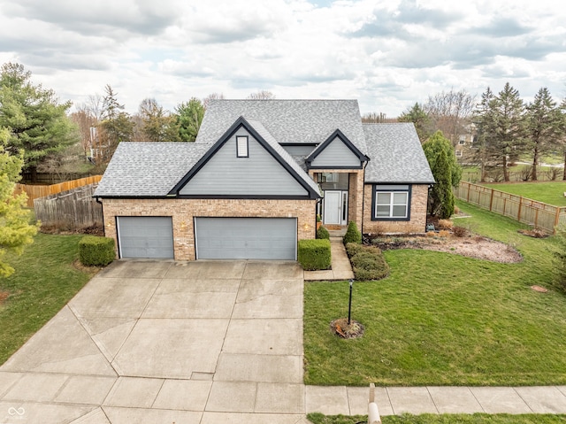 11229 Echo Ridge Ln, Indianapolis, IN 46236 - view of front of home featuring a shingled roof, concrete driveway, brick siding, and an attached garage