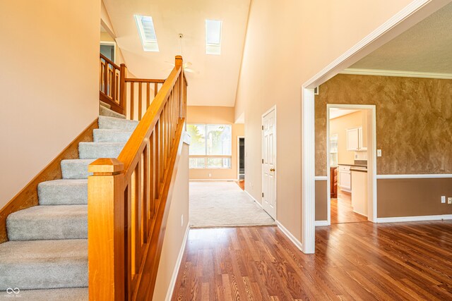 11229 Echo Ridge Ln, Indianapolis, IN 46236 - staircase with a skylight, wood finished floors, and a towering ceiling