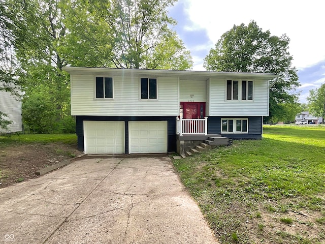 2928 Sheffield Dr, Indianapolis, IN 46229 - split foyer home featuring a garage, driveway, and a front yard