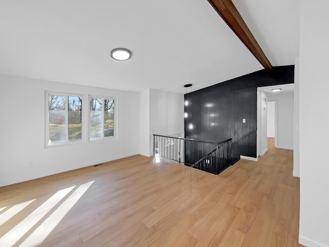 2928 Sheffield Dr, Indianapolis, IN 46229 - unfurnished living room with wood finished floors and baseboards