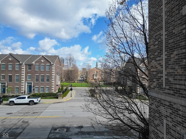 view of road with sidewalks and curbs