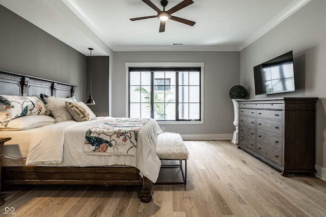 12099 Sigillary Way, Carmel, IN 46032 - bedroom featuring light wood finished floors, ornamental molding, and a ceiling fan